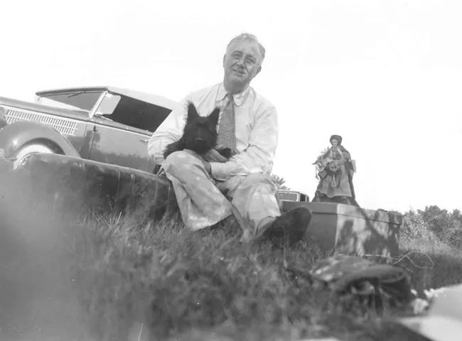 President of Pretty| Franklin D. Roosevelt and a four-month-old Fala enjoy a picnic near Pine Plains, New York on Aug. 8.