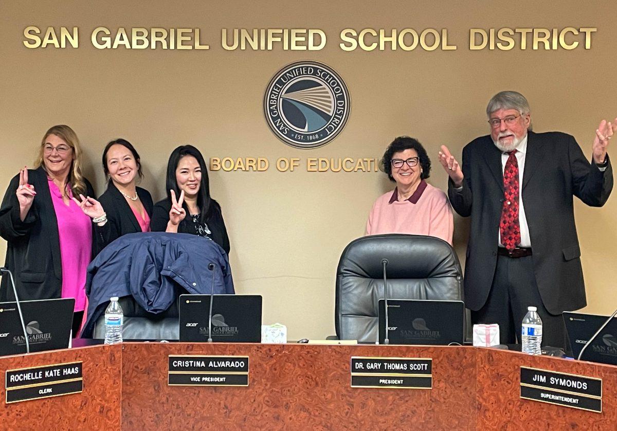 COMMUNITY LEADERS Governing Board members (left to right) Shellhart, Haas, Chi, Alvarado, and Scott show their lighthearted side before getting to business at a board meeting on Feb. 14.