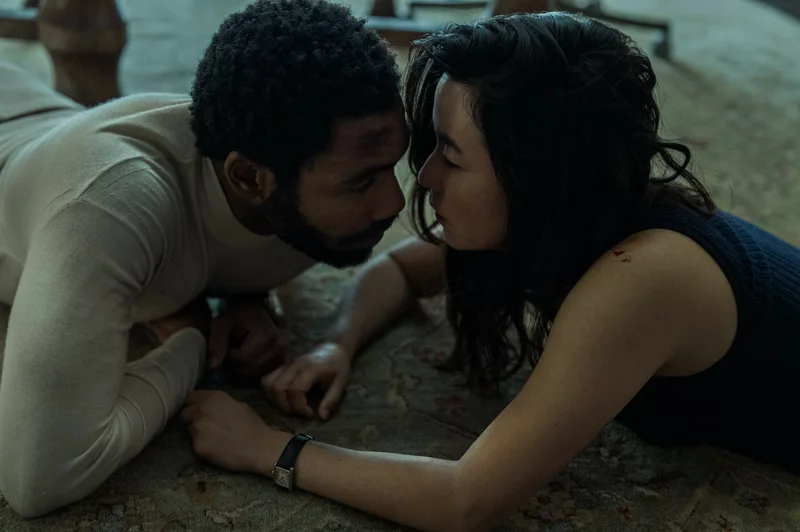 Donald Glover and Maya Erskine share a tense moment during their work as spies in Mr. and Mrs. Smith | Photo courtesy of David Lee/Prime Video 