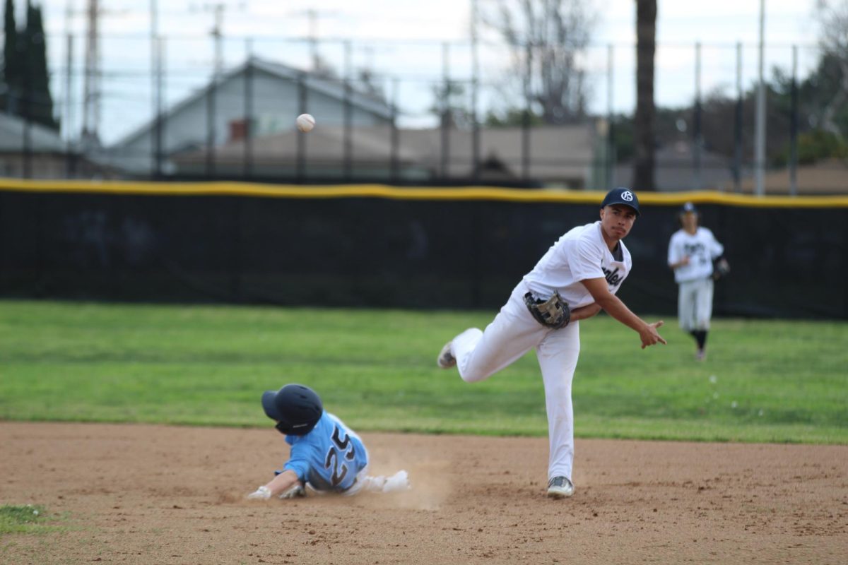 Varsity Captain, Isaac Perez (6) harnesses power and precision on 2nd base. 