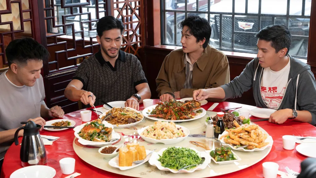 Wang (far left) interviews the cast of The Brothers Sun (right to left: co-creator Byron Wu, actor Sam Song Li, actor Justin Chien) in a Netflix Food Tour | 
Photo courtesy of The Hollywood Reporter