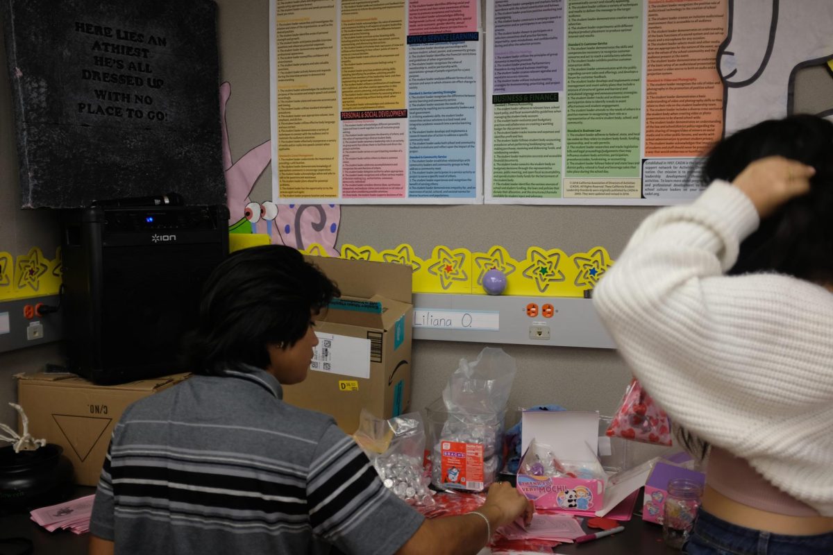 ASB officers of school spirit work on kindness grams. 