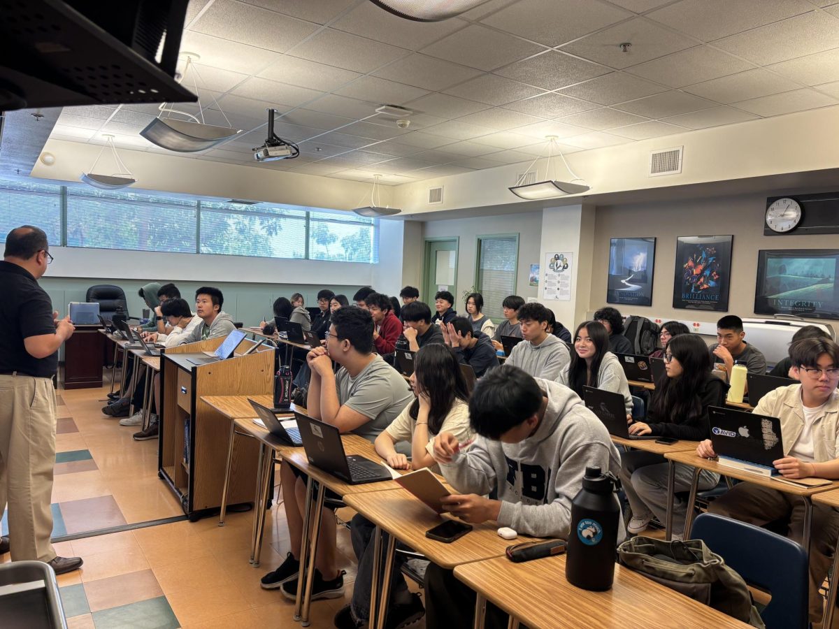 Math teacher Jorge Salas instructs students in his classroom.