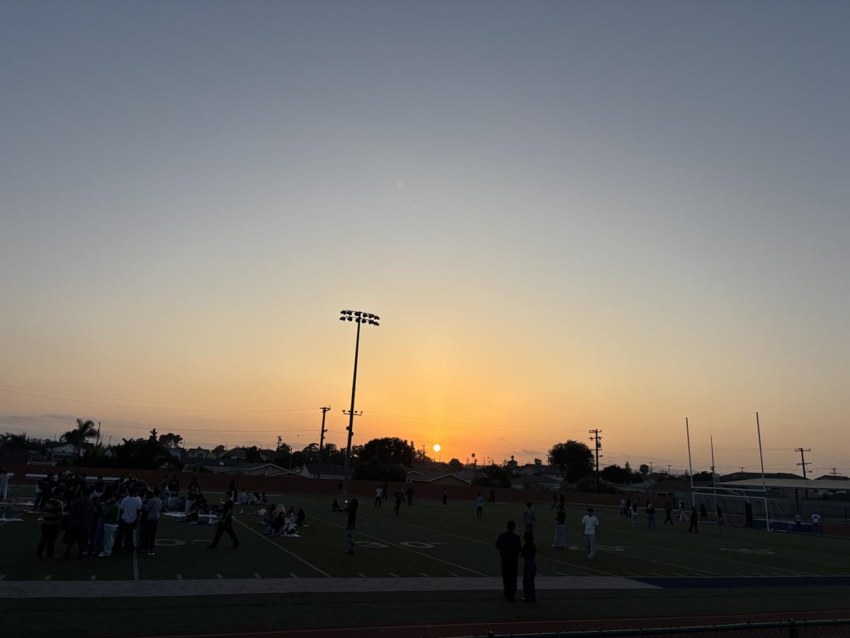 The view of the sunset from the bleachers of Eagle Stadium during Senior Sunset.