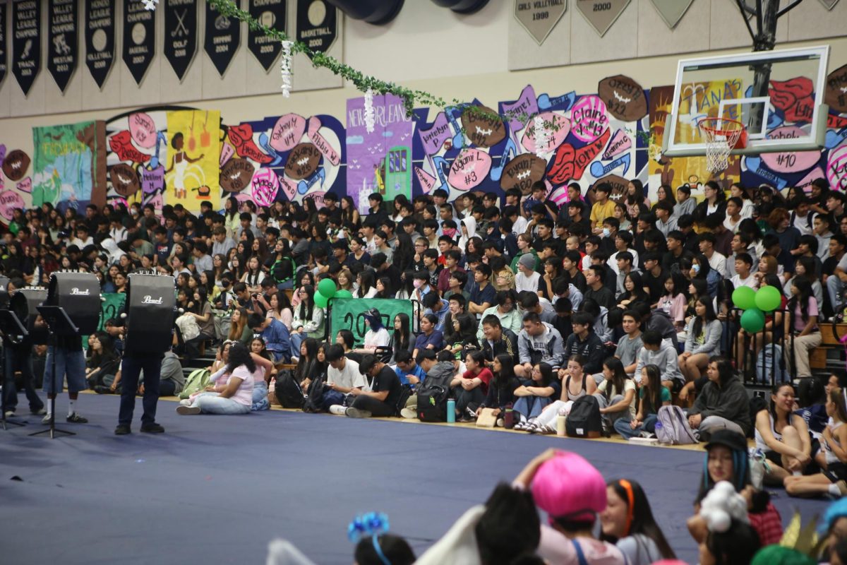 Freshmen and Juniors packing up bleachers at the Fall Rally