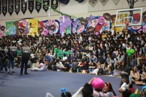 Freshmen and Juniors packing up bleachers at the Fall Rally