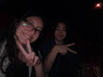 Seniors Sophia Sanchez and Owen Dowell posing while watching the Hamilton Movie in Theaters.