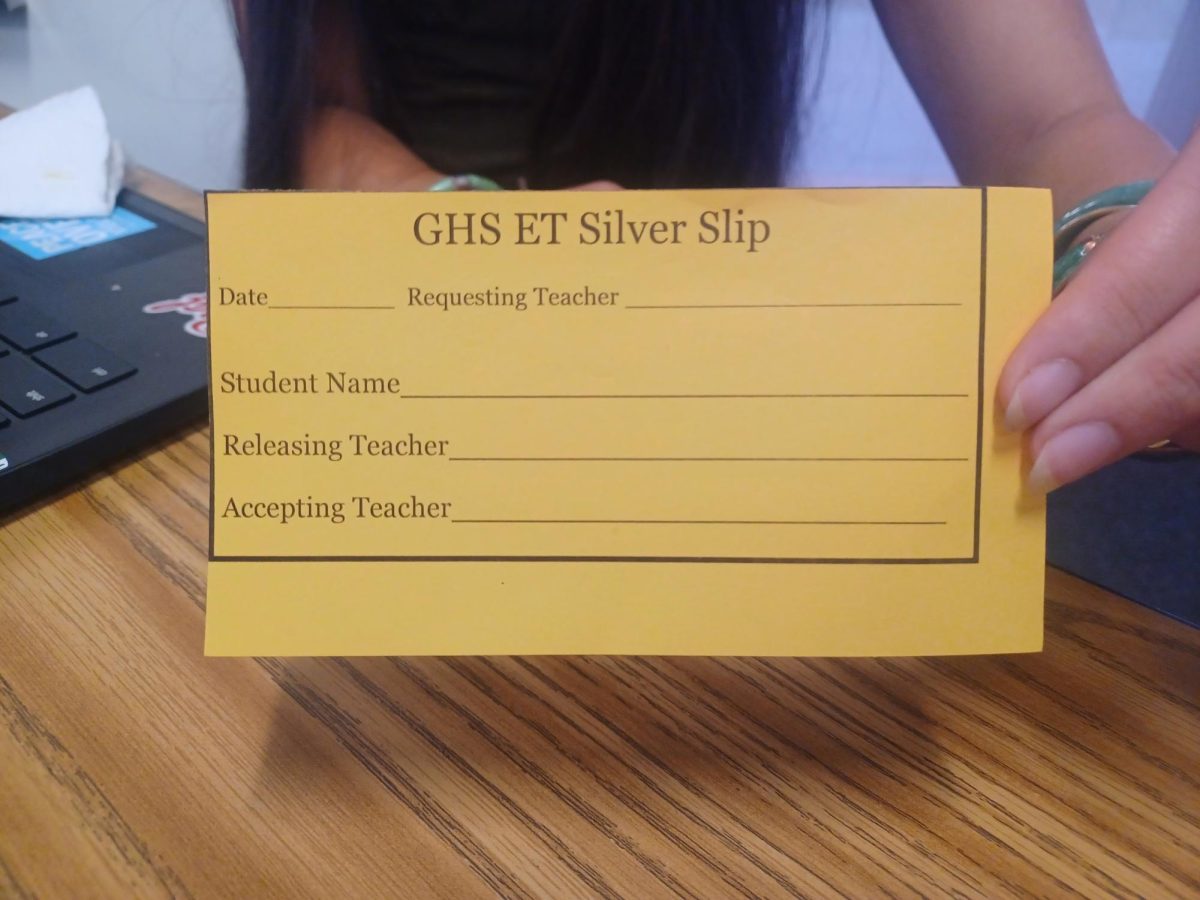 An image of a silver slip which allows students to change classrooms during Embedded Time.