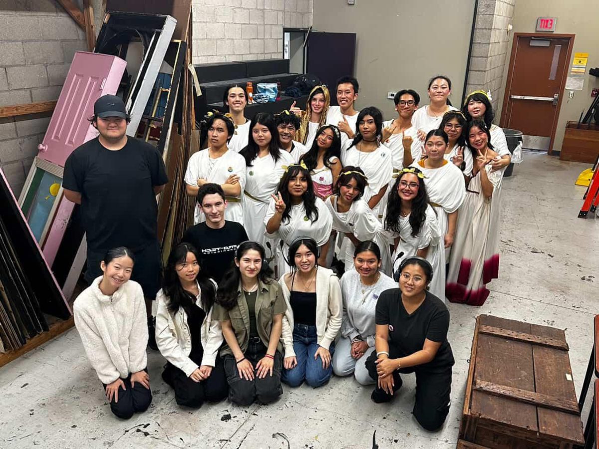Members of the fall play pose for a photo.