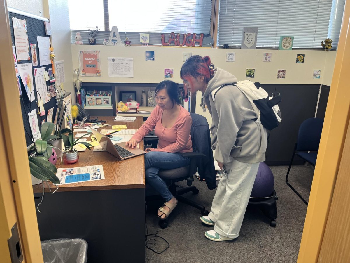 Gabrielino High School counselor Amanda Ly meets with a student to review course options before the schedule change and pre-registration period.