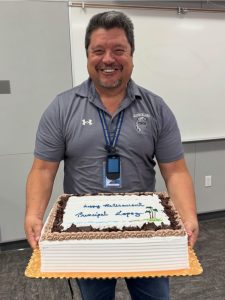 Vincent Lopez being very jolly and whimsical while holding a cake saying "Happy Retirement Principal Lopez!"

Photo courtesy: @gabrielinoptsa