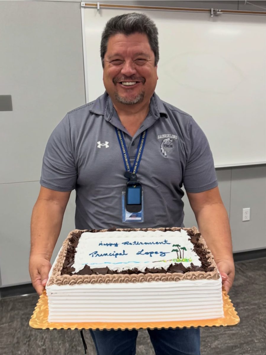 Vincent Lopez being very jolly and whimsical while holding a cake saying "Happy Retirement Principal Lopez!"

Photo courtesy: @gabrielinoptsa